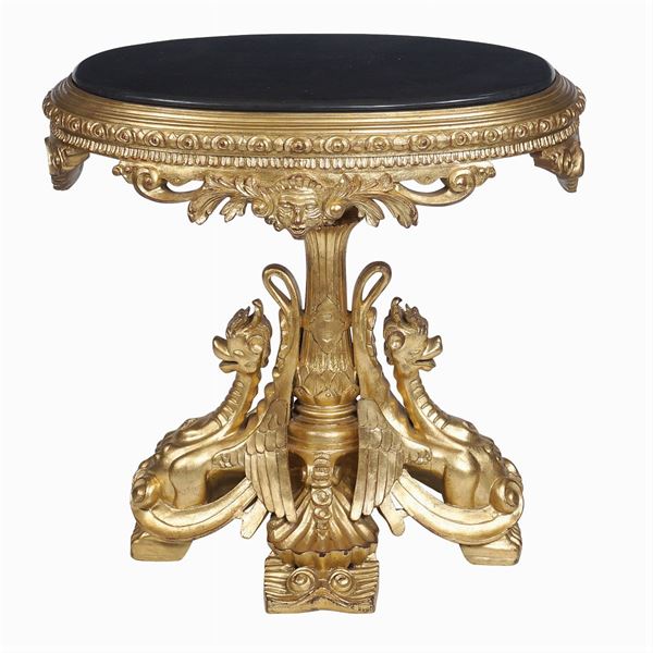 A gilt wood oval table