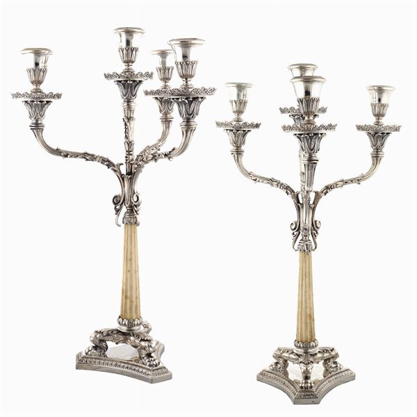 A pair of four lights silver candelabra