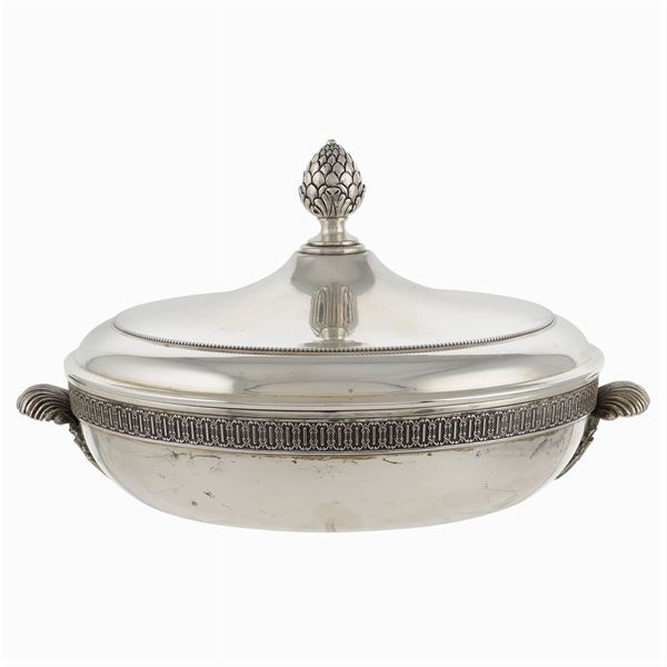 A round silver vegetable dish