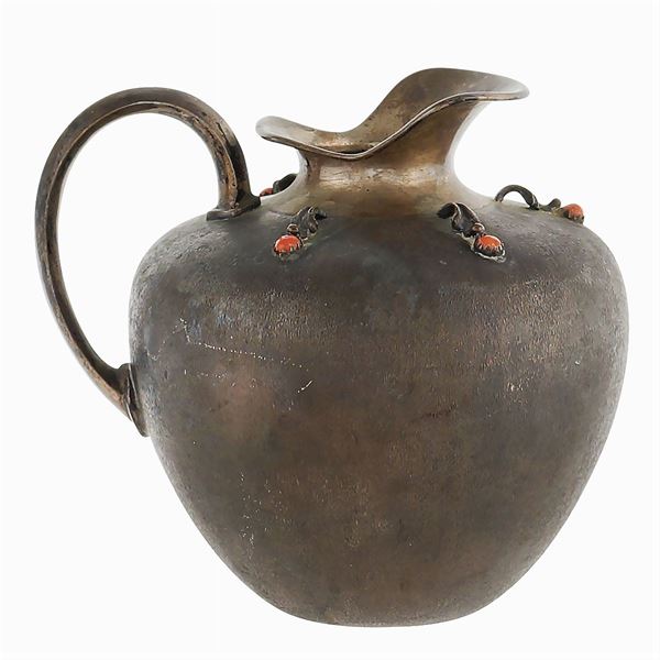An small silver jug