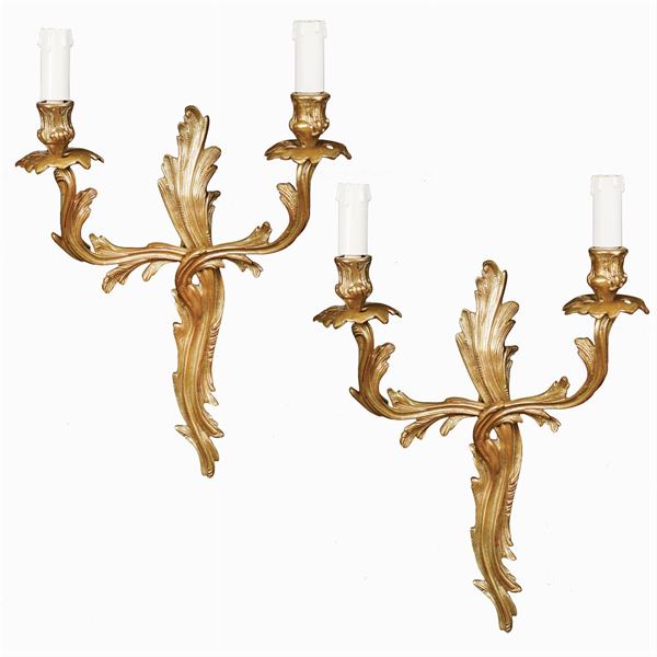 A pair of golden brass two lights appliques