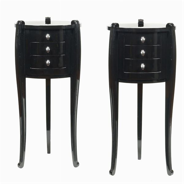 A pair of black laquered wooden sideboards