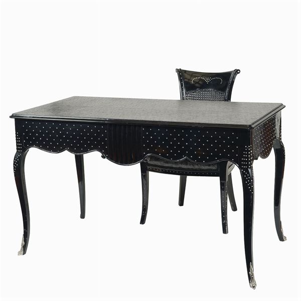 A wavy lined desk and armchair