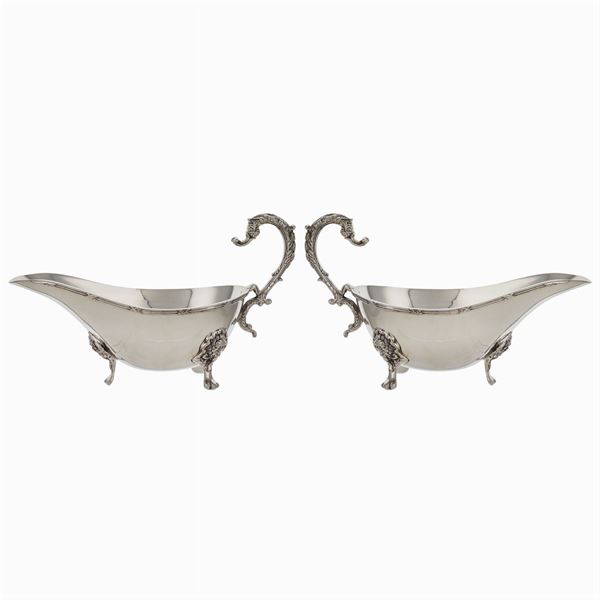 A pair of silver plated gravy boats