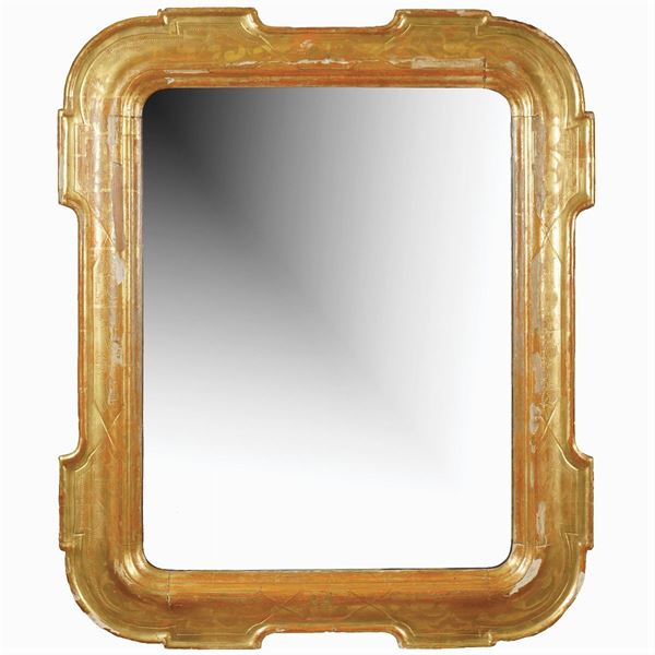 A rectangular golden wood wall mirror