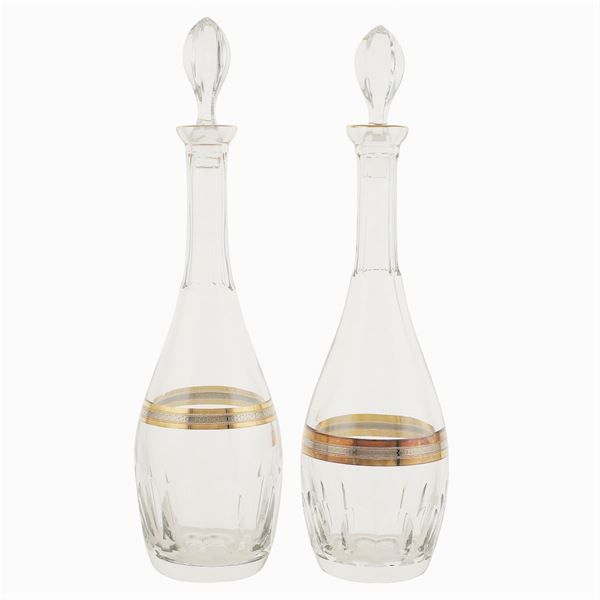 A pair of polished crystal bottles
