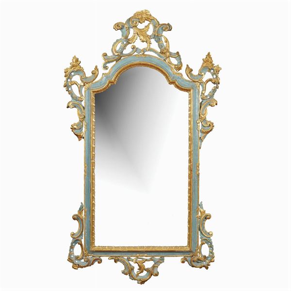 A laquered and golden wood wall mirrror