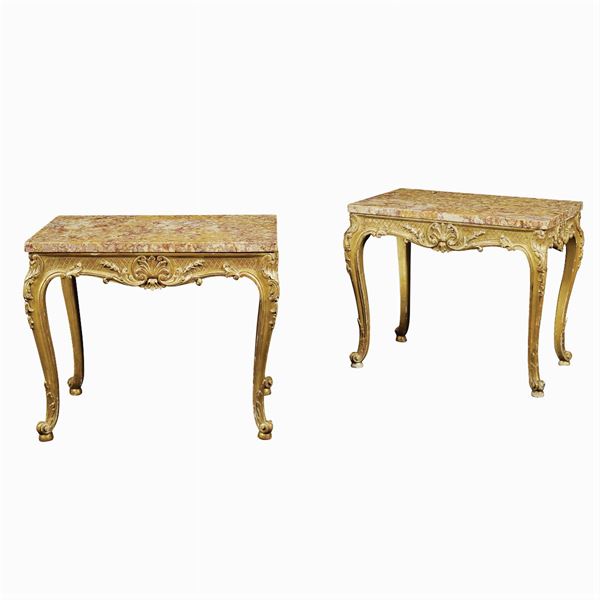 A pair of golden wood tables