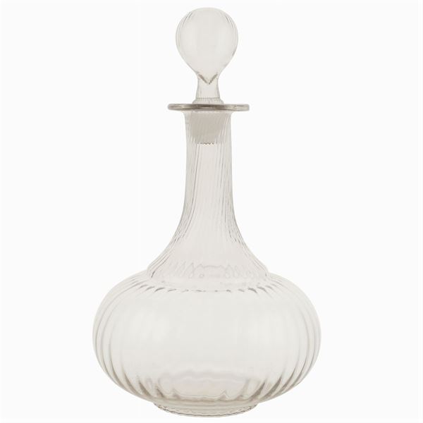 A glass decanter with its cap