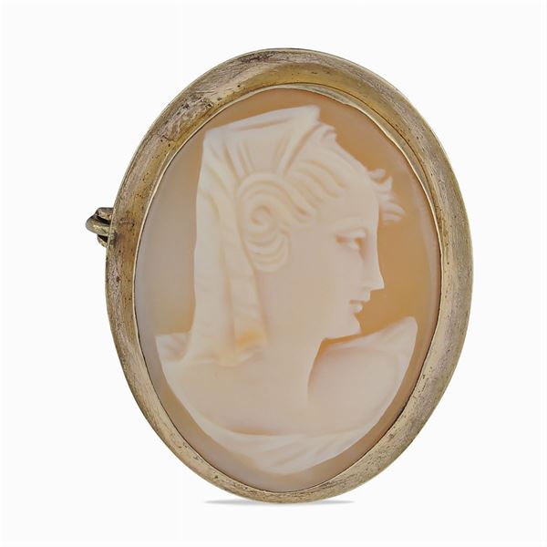 A cameo brooch with a female profile