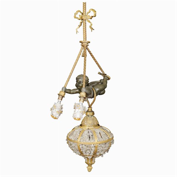 A three lights burnished and golden bronze chandelier