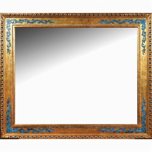 A rectangular wooden wall mirror