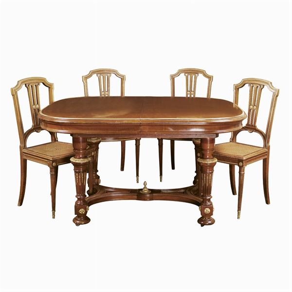 A walnut table with six chairs