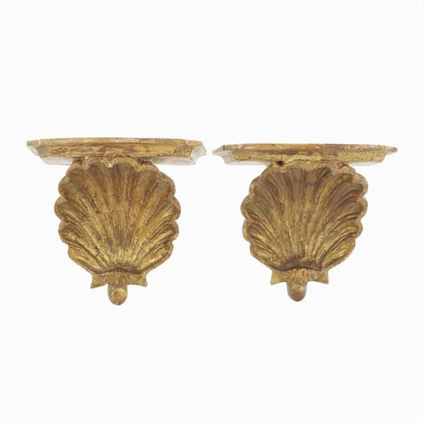 A pair of golden small wood shelves