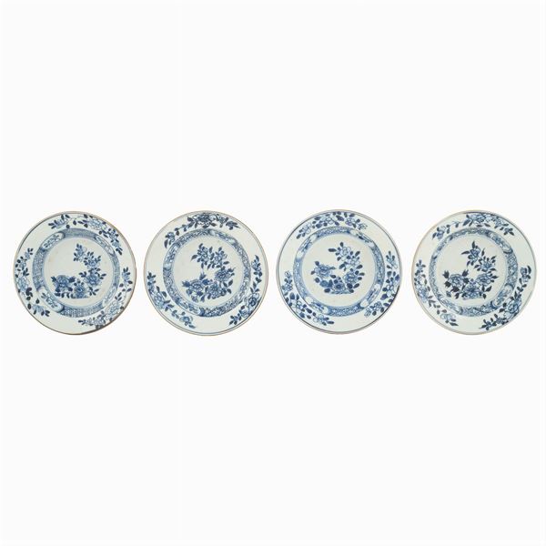 Four small porcelain soup plates