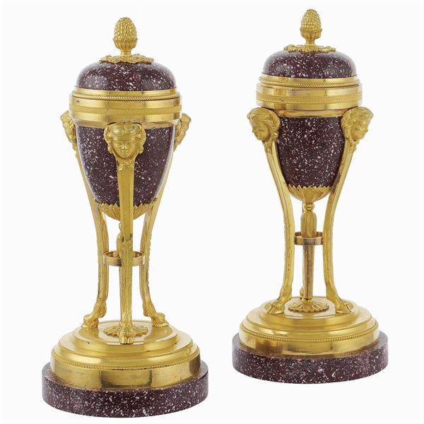 A pair of red porphyry cassolettes