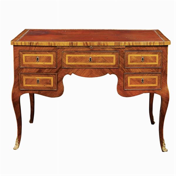 A walnut and olive wood centerpiece writing desk