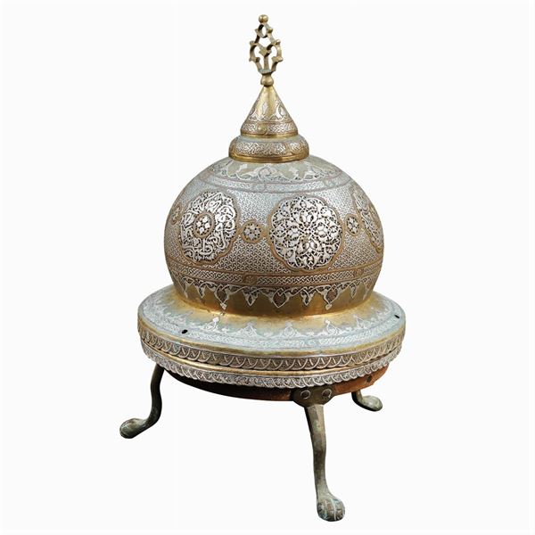 A silvered metal brazier