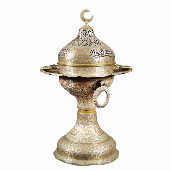 A silvered metal brazier