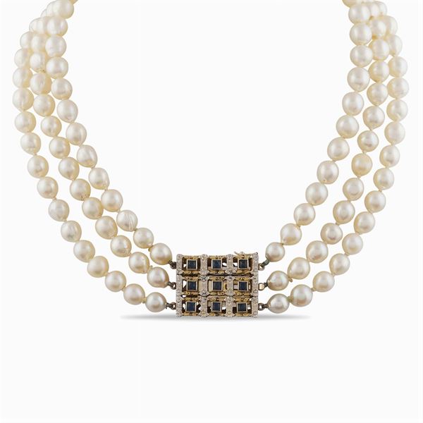 A three strings of cultivated pearls necklace