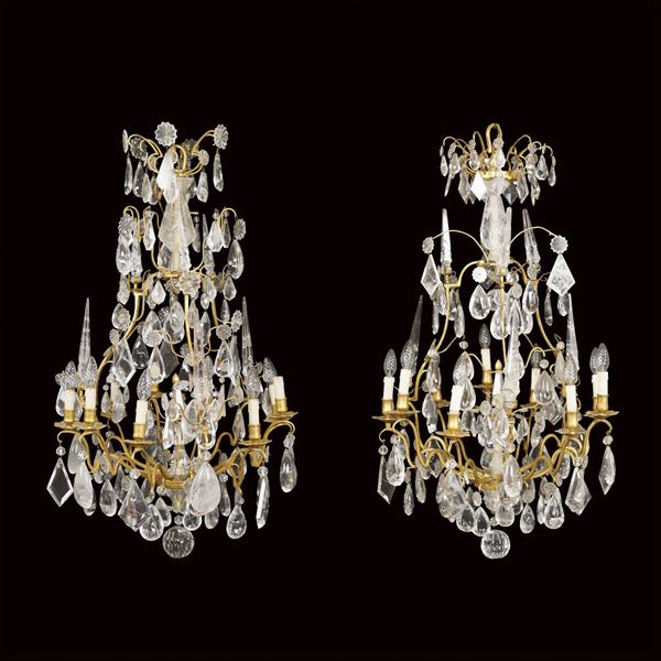 An important pair of bronze and rock crystal chandeliers