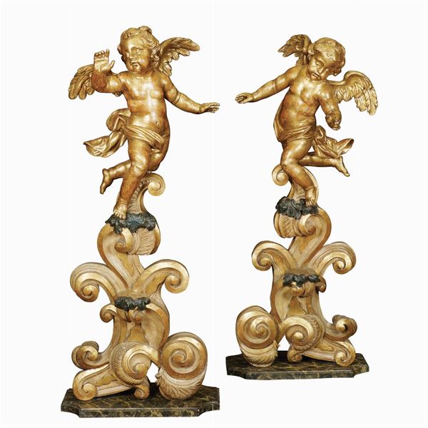 A pair of golden wood sculptures