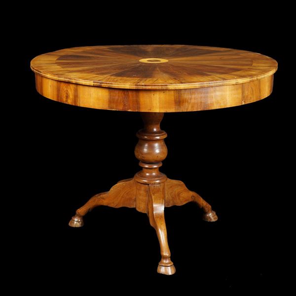 A walnut and olive wood centerpiece table