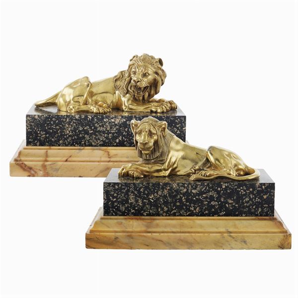 A pair of golden bronze sculptures