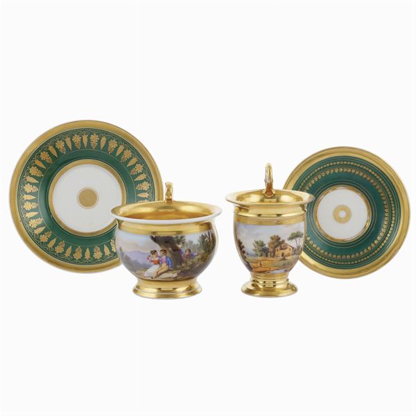 A pair of two cups with porcelain saucers