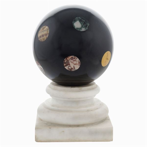 An ornamental sphere in black Belgium marble