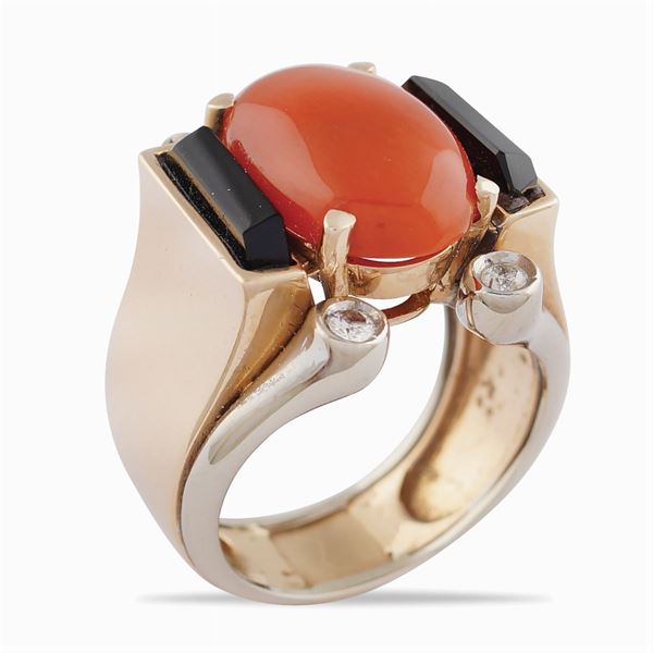 A rose and white gold bridge ring with coral