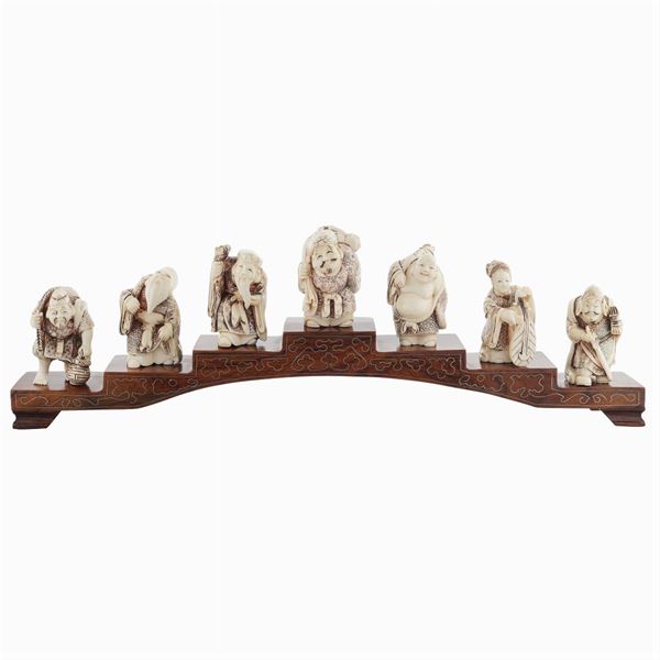 A collection of seven netsuke in bone