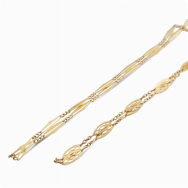 A pair of two 9kt gold antique chains