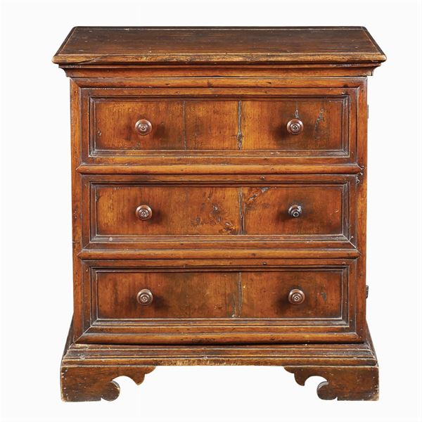 An antique walnut bedside table