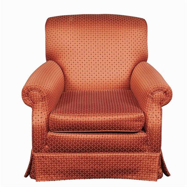 An entirely padded and covered in fabric armchair