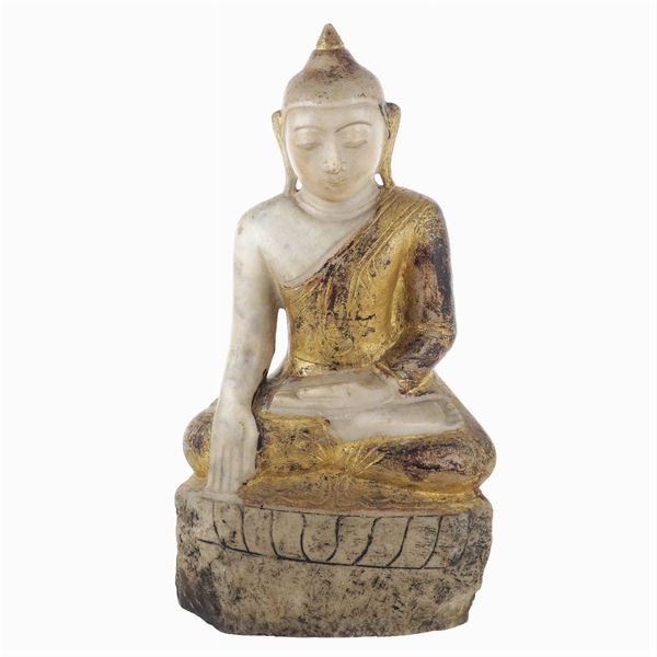 A partially golden marble Buddha