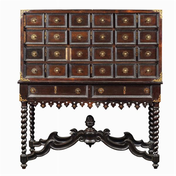 A walnut coin cabinet