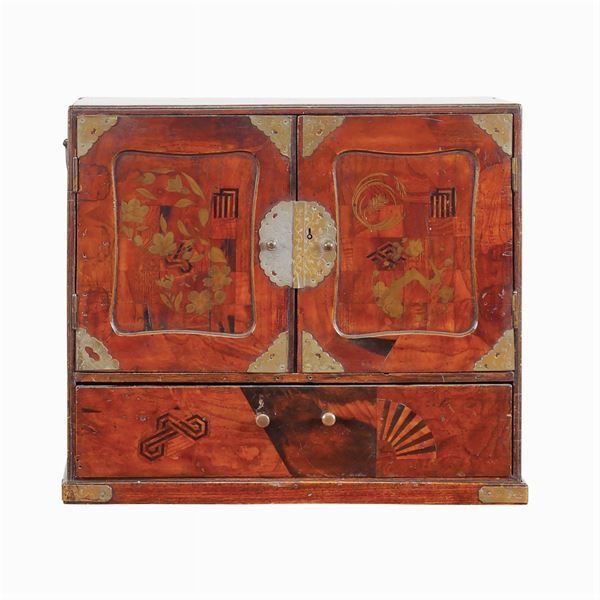 A travel cabinet in different woods
