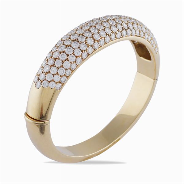 Bracciale manetta in oro giallo 18kt e diamanti