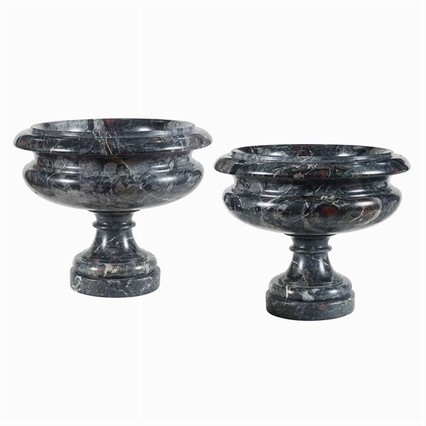 A pair of turned african marble stands