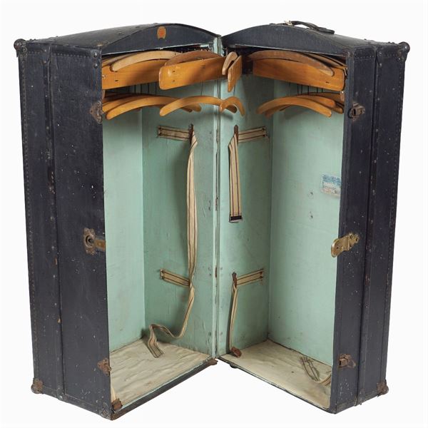 A vintage travel wardrobe trunk