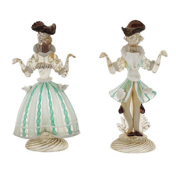 A pair of figures in polychrome glass