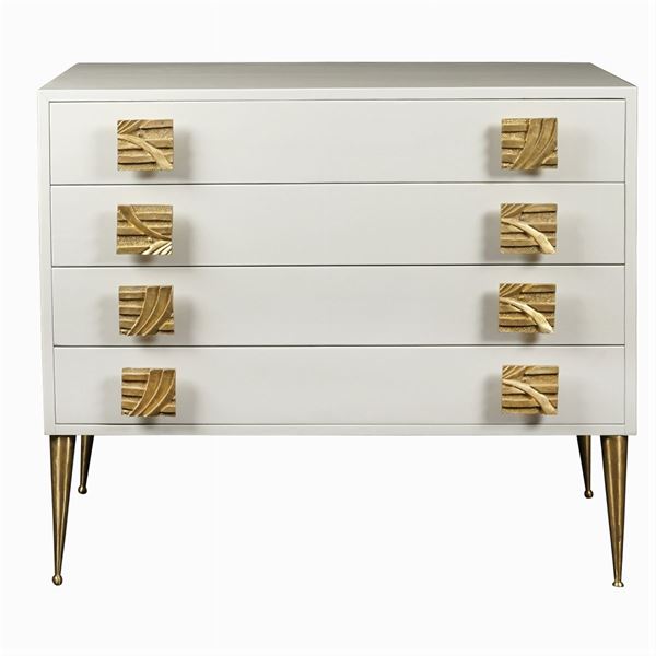 A white lacquered chest of drawers