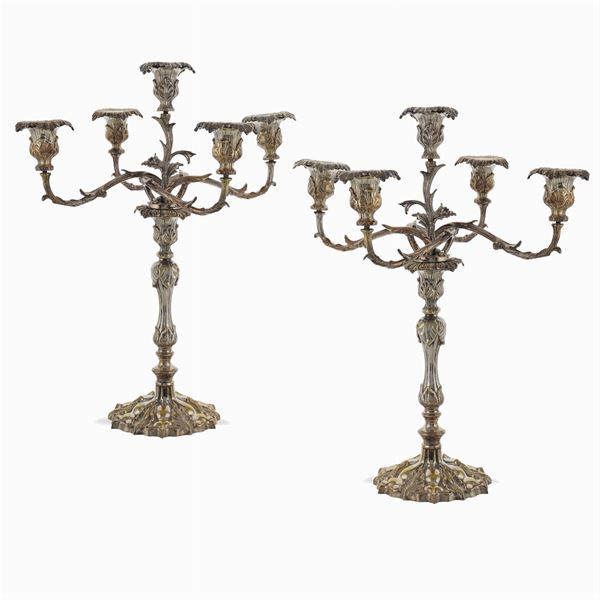 A pair of five lights chandeliers