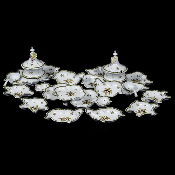 An enamelled ceramic dinner service