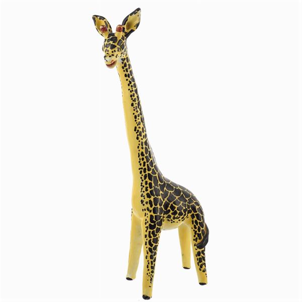 A ceramic giraffe scuplture