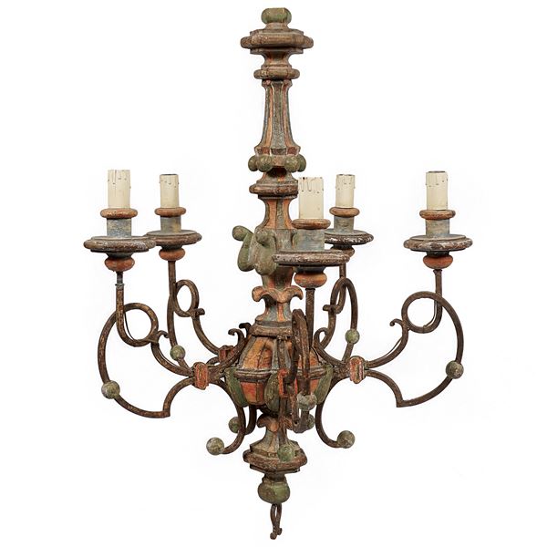 A lacquered wood chandelier with five lights