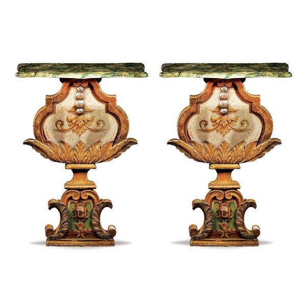 A pair of lacquered and giltwood consoles