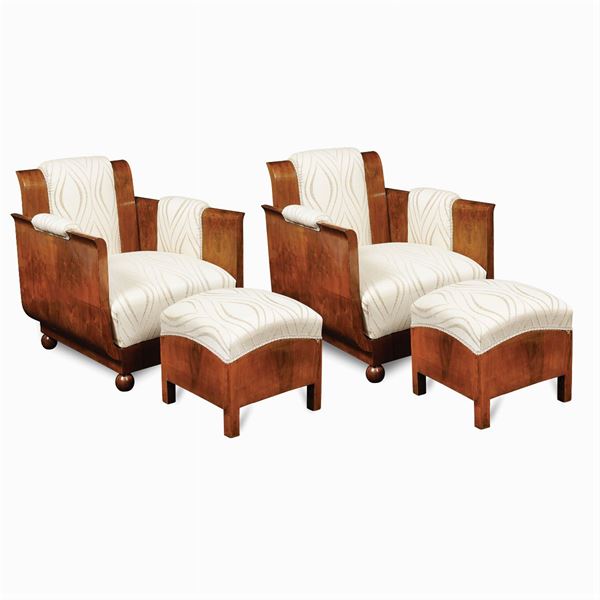 A pair of Decò armchairs and footstools