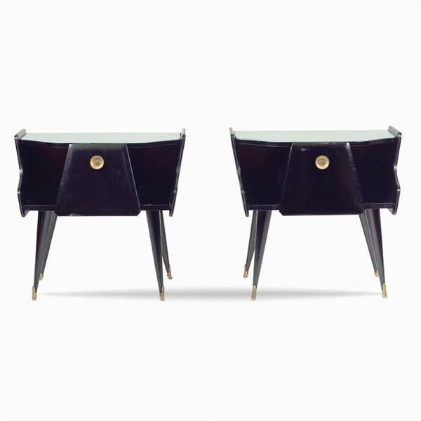 A pair of ebonized wood bedside tables